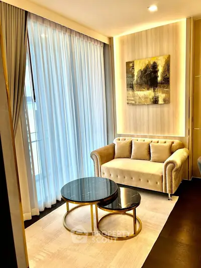 Luxurious living room with elegant sofa and chic coffee tables, featuring floor-to-ceiling windows and stylish decor.