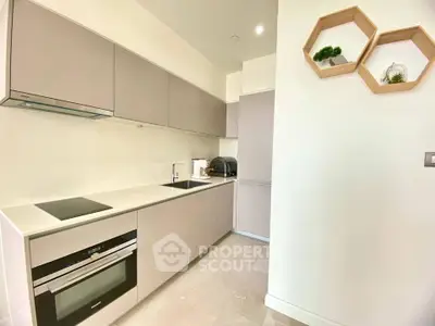 Modern kitchen with sleek cabinetry and built-in appliances in a bright, minimalist design.