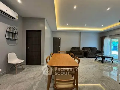 Spacious modern living room with elegant dining area and stylish furniture