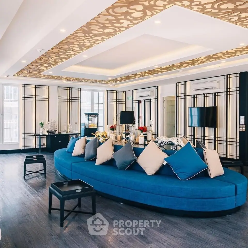 Luxurious modern living room with elegant decor and spacious seating area.