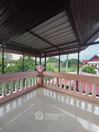 Spacious balcony with scenic views and elegant railing, perfect for relaxation and outdoor enjoyment.