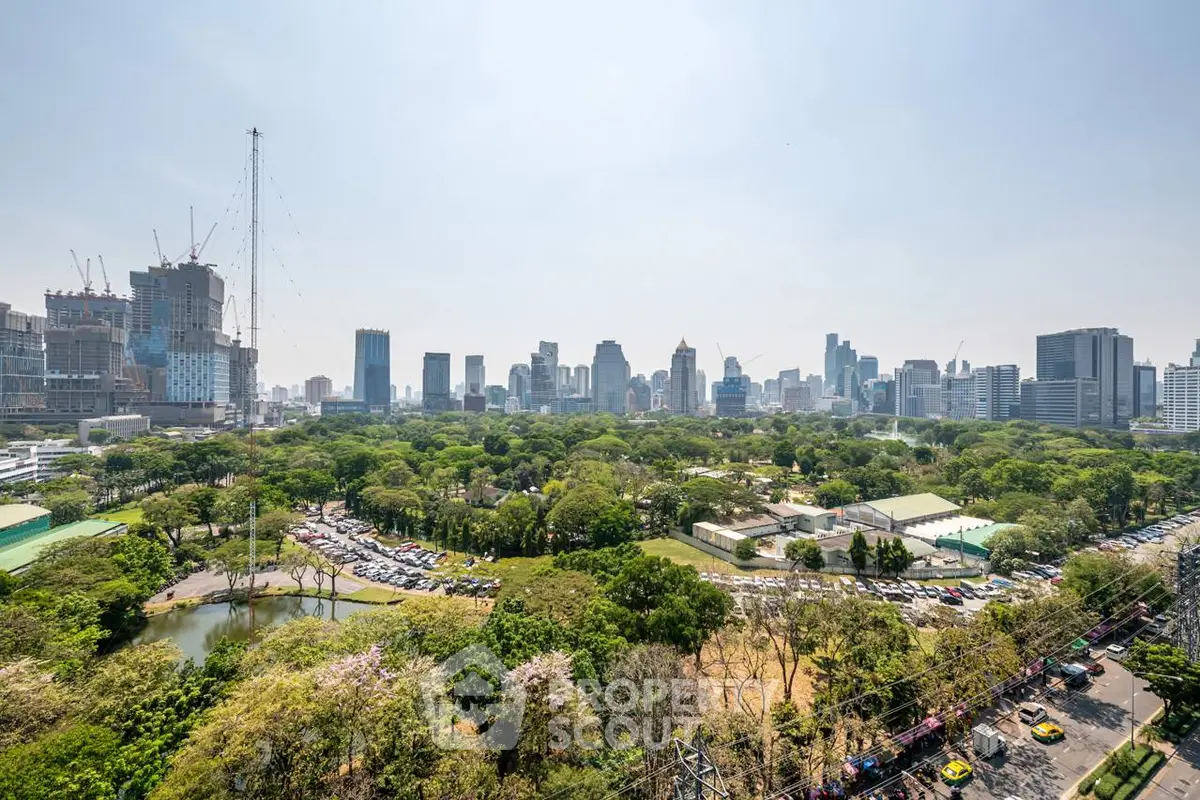 Stunning cityscape view with lush green park and skyline, perfect for urban living enthusiasts.