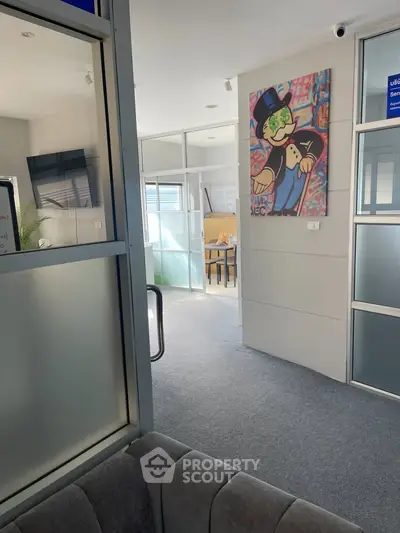 Modern office space with stylish decor and glass partitions