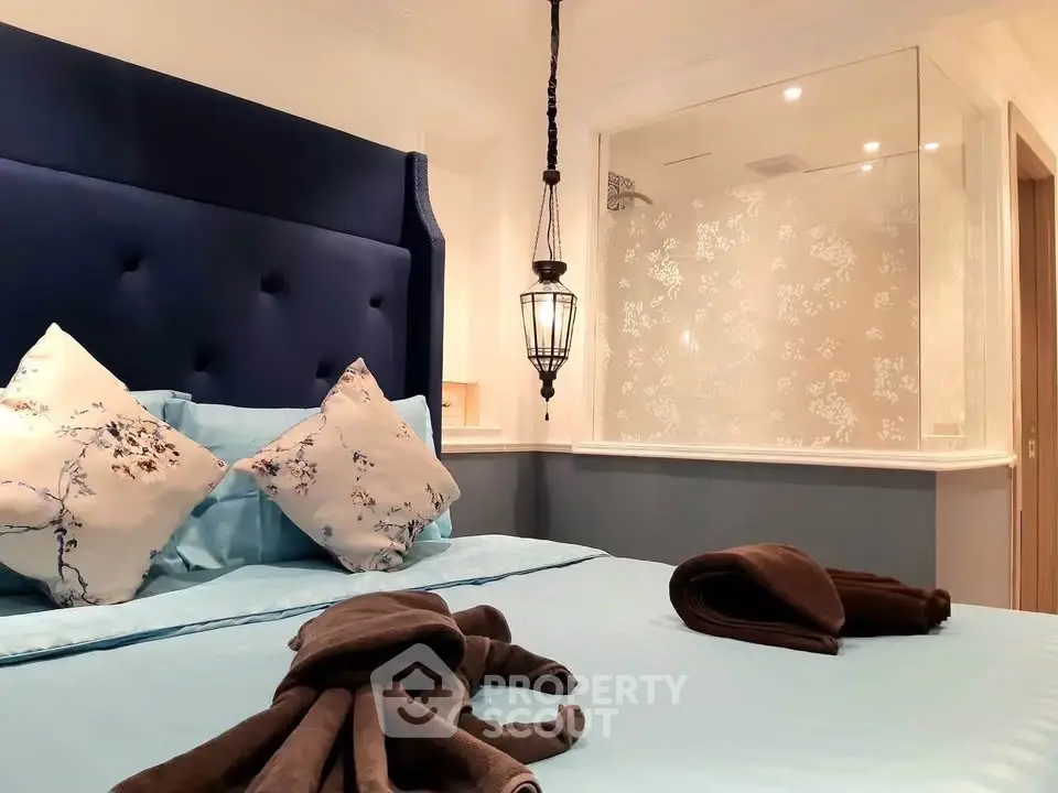 Luxurious bedroom with elegant decor and glass partition