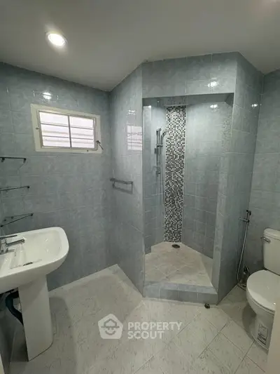 Modern bathroom with sleek shower and elegant tile design