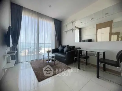 Modern living room with floor-to-ceiling windows and sleek furniture.