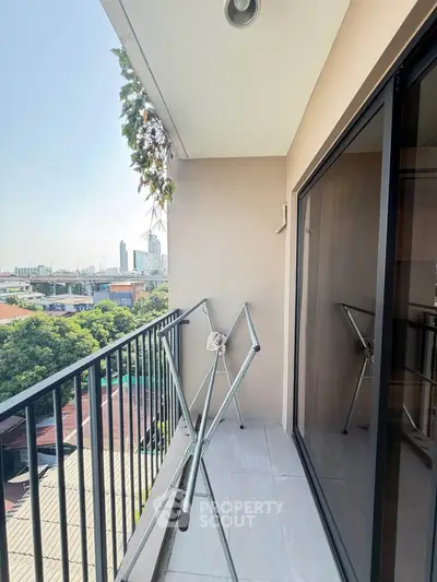 Charming balcony with city view, perfect for relaxation and enjoying the skyline.