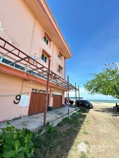 Charming seaside building with potential for renovation and stunning ocean views.