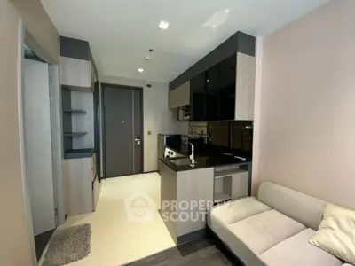 Modern apartment interior with sleek kitchen and cozy living area