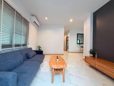 Modern living room with sleek furniture and stylish decor