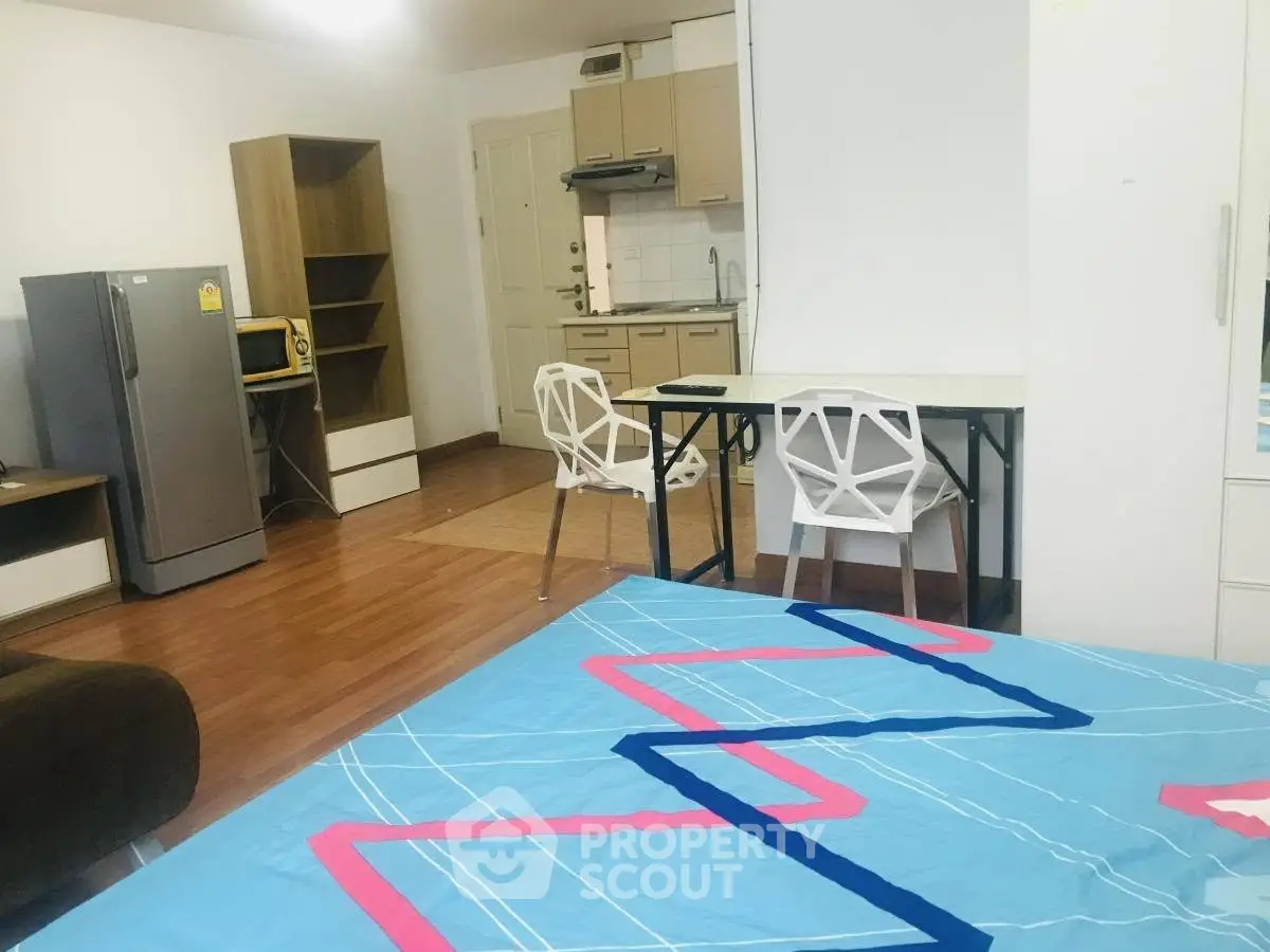 Modern studio apartment with open kitchen and stylish decor