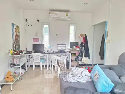 Cozy living room with dual workstations and modern decor