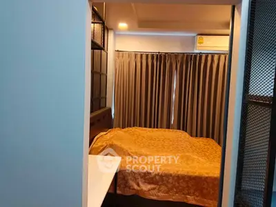 Cozy bedroom with modern design and warm lighting, featuring a comfortable bed and stylish curtains.