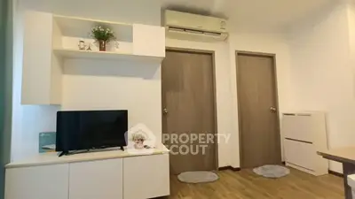 Modern living room with air conditioning and wooden flooring