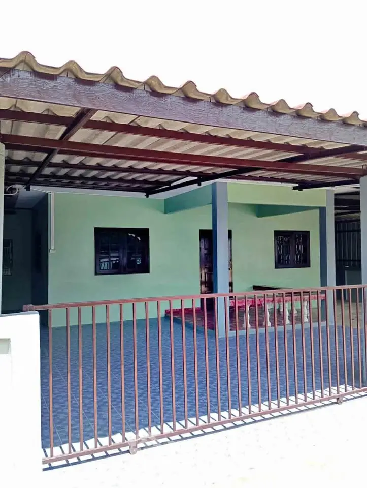 Charming single-story home with covered patio and gated entrance, perfect for family living.
