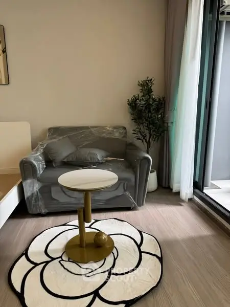 Cozy living room with modern decor and balcony access