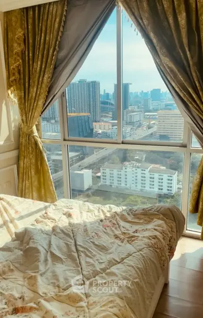 Luxurious bedroom with city view from large window and elegant curtains