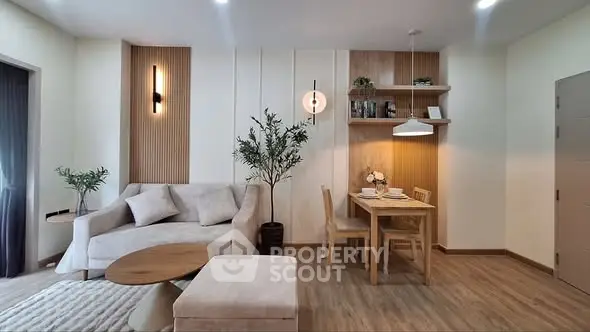 Modern living room with cozy dining area and stylish decor