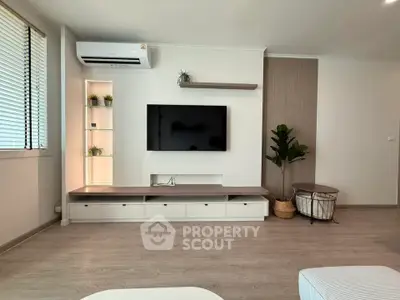 Modern living room with sleek TV setup and stylish decor