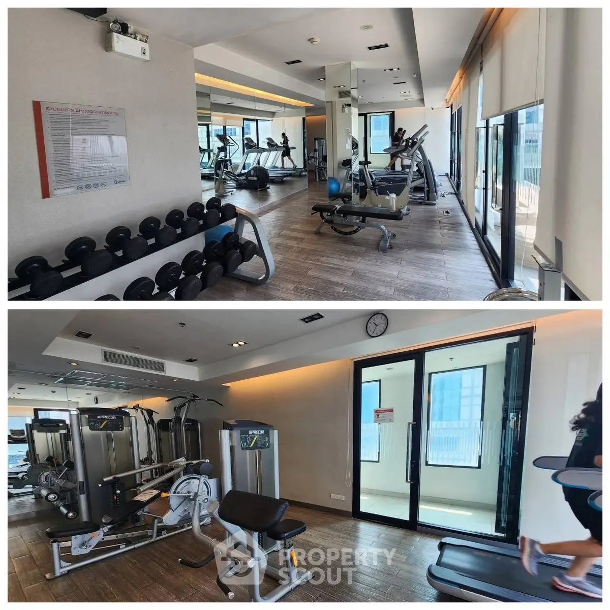 Modern gym with state-of-the-art equipment and large windows offering city views.