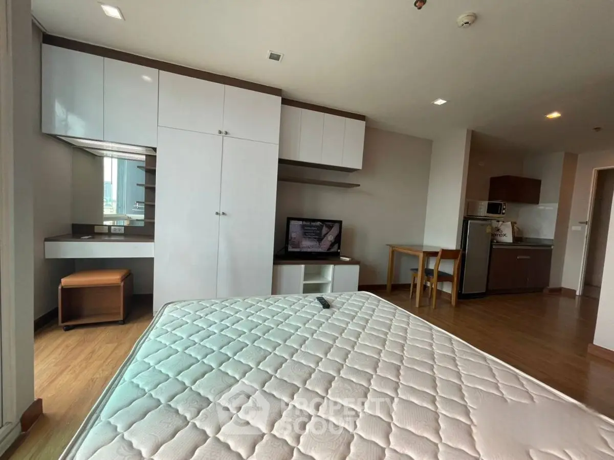 Modern studio apartment with sleek furniture and cozy ambiance