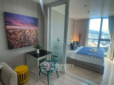 Modern bedroom with city view, stylish decor, and natural light in a contemporary apartment.