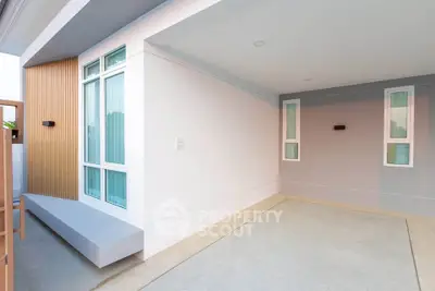 Modern exterior of a minimalist home with clean lines and large windows.