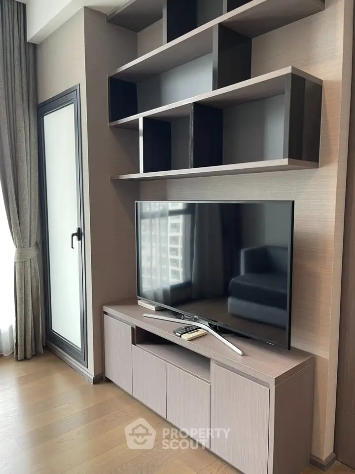Modern living room with sleek TV unit and stylish shelving, perfect for contemporary urban living.