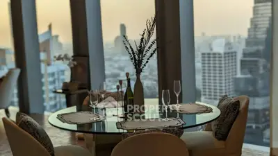 Luxurious dining area with panoramic city view, featuring elegant table setting and modern decor.