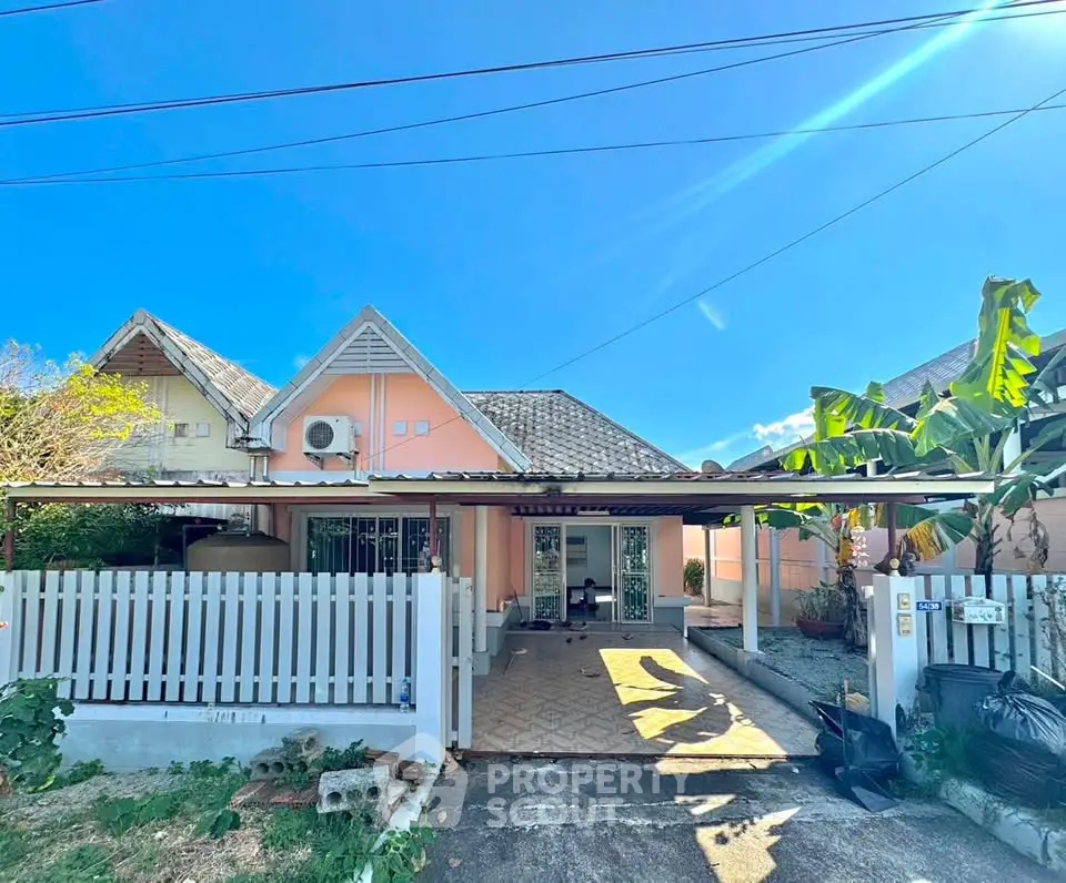 Charming single-story home with a spacious front yard and inviting entrance, perfect for family living.