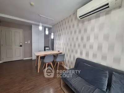 Modern living room with stylish furniture and air conditioning in a cozy apartment.