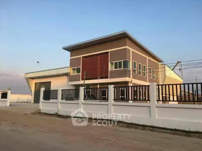 Modern industrial building with sleek design and spacious layout.