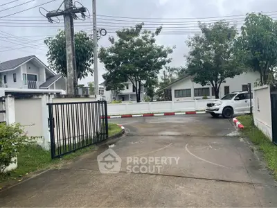 Charming residential neighborhood with modern houses and lush greenery, perfect for family living.