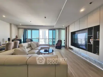 Spacious modern living room with large windows and city view