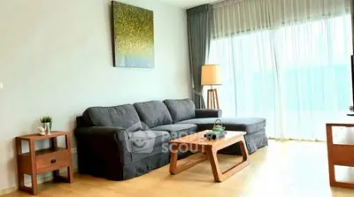 Spacious living room with modern sofa and natural light