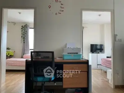 Spacious study area with dual bedroom access in modern apartment