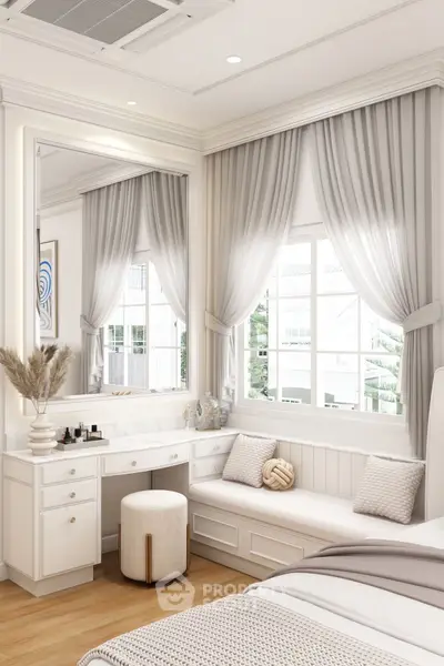 Elegant bedroom with cozy seating and natural light