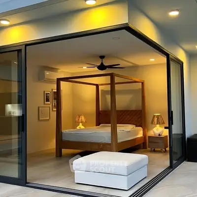 Luxurious modern bedroom with glass walls and elegant lighting