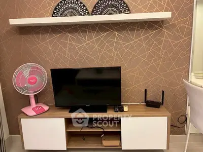 Modern living room with stylish TV stand and geometric wallpaper