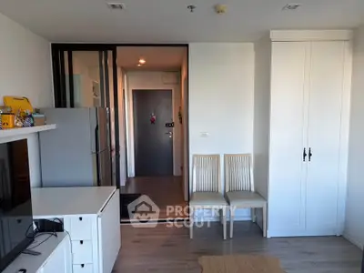 Modern living room with sleek furniture and stylish decor in a contemporary apartment.