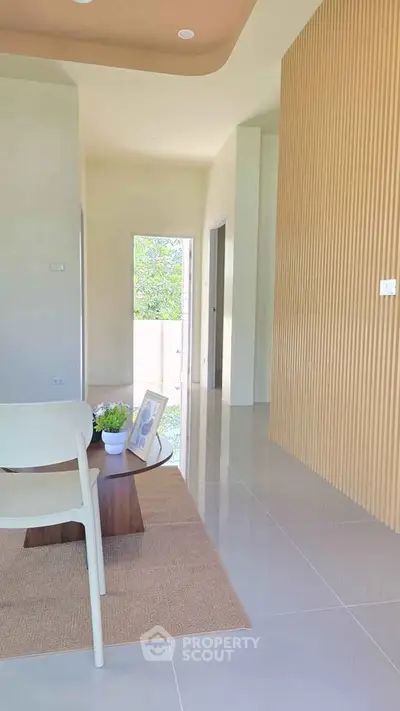 Modern interior with sleek design and natural light, featuring a stylish living area and elegant decor.