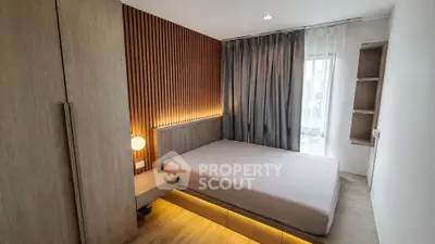Modern bedroom with stylish wood paneling and ambient lighting