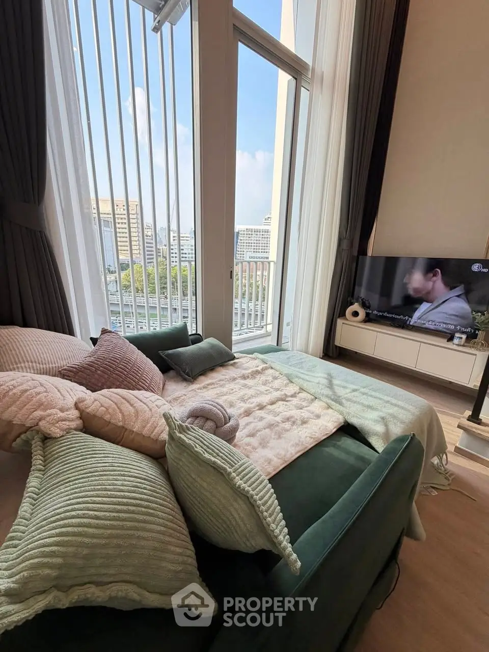 Luxurious living room with large windows and cozy seating area