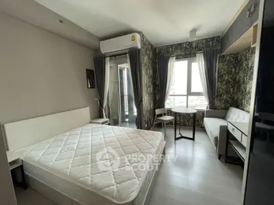 Modern bedroom with large window, air conditioning, and stylish decor