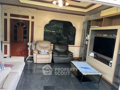 Spacious living room with elegant decor and modern entertainment setup