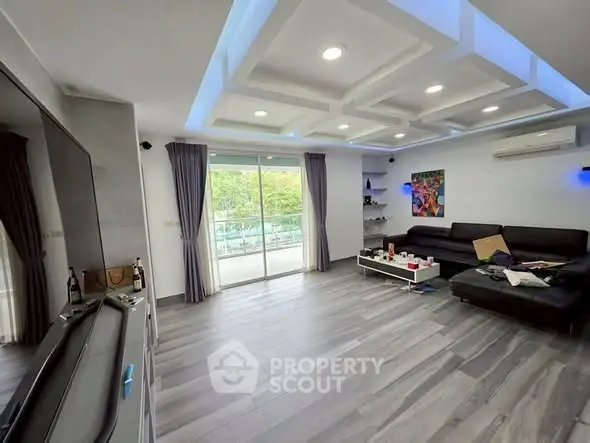 Spacious modern living room with sleek design and large windows