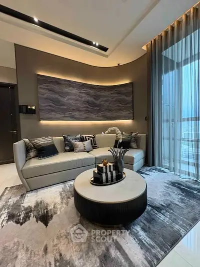 Luxurious modern living room with elegant decor and large windows offering stunning views.