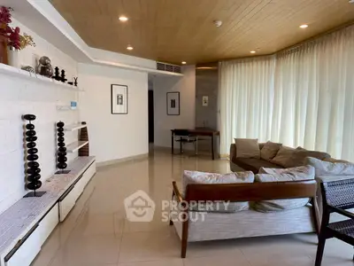 Spacious modern living room with elegant decor and natural light