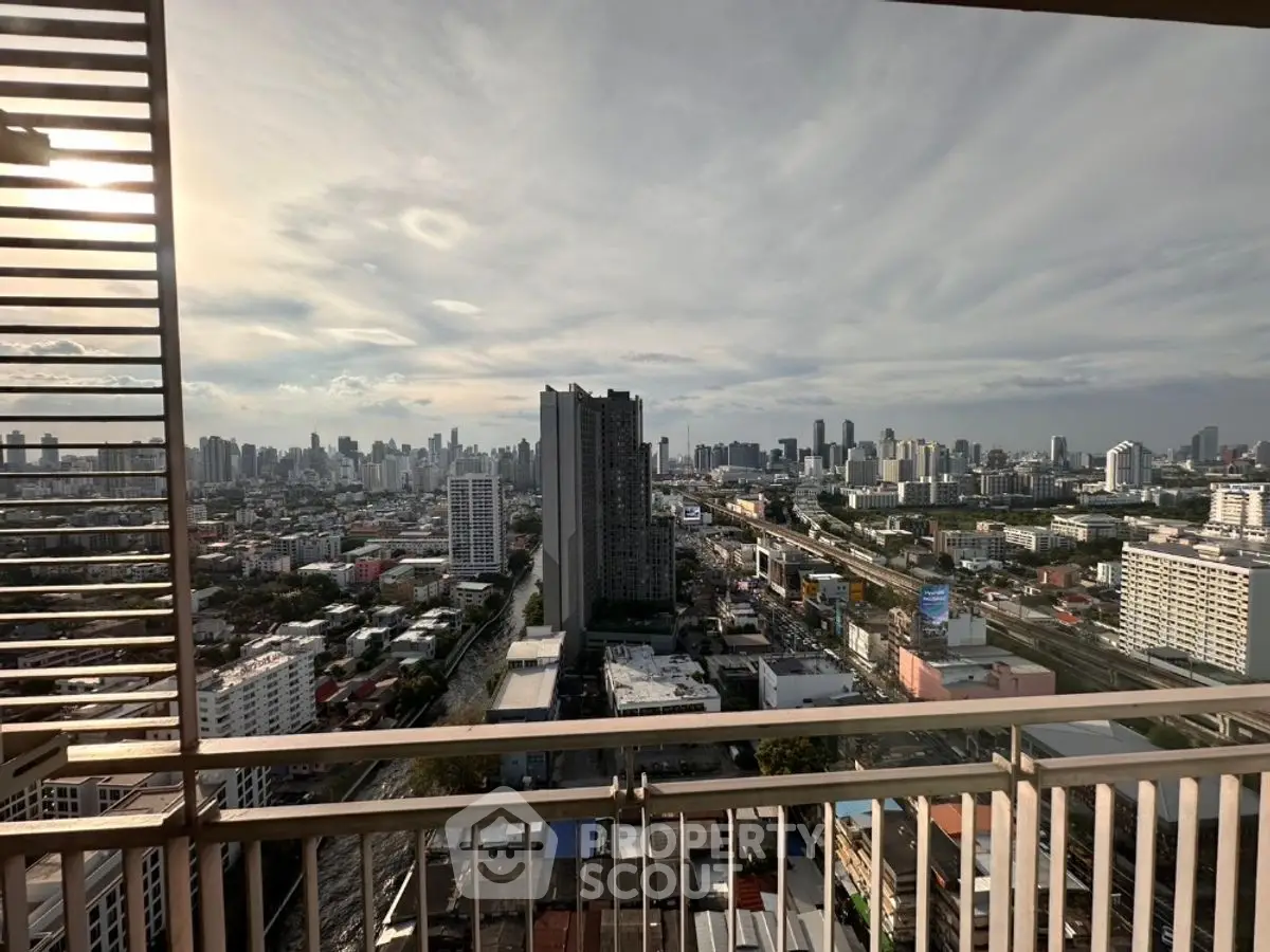 Stunning cityscape view from high-rise balcony with expansive skyline.