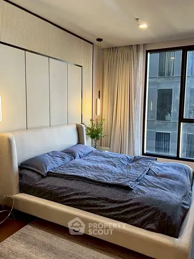 Luxurious bedroom with modern design and large window view